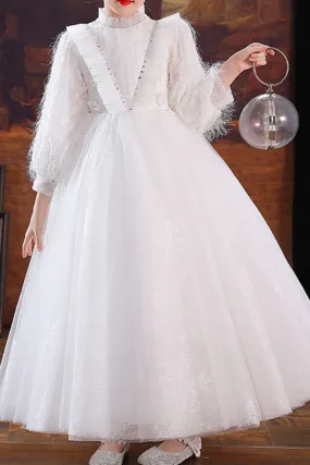 Jolie Robe petite fille blanche en tulle avec haut et  manches longues stylés